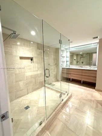 a view of a bathroom with a sink and mirror
