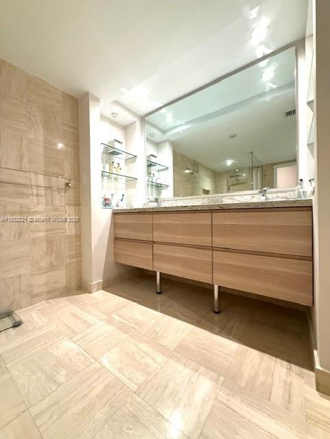 1121 Crandon Boulevard, Unit D702 Key Biscayne, FL 33149 - Photo 20 of 51 a bathroom with a mirror and a shower