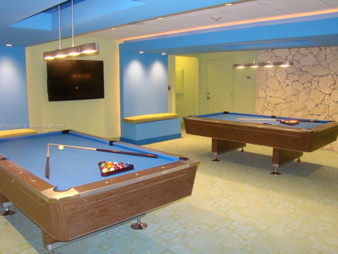 1121 Crandon Boulevard, Unit D702 Key Biscayne, FL 33149 - Photo 45 of 51 a room with pool table and a flat screen tv