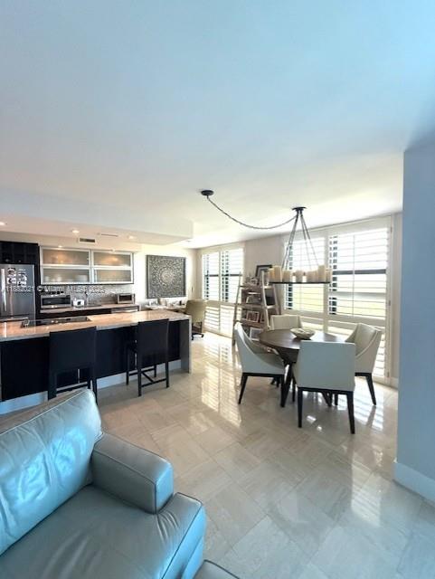 1121 Crandon Boulevard, Unit D702 Key Biscayne, FL 33149 - Photo 6 of 51 a living room with furniture and a kitchen