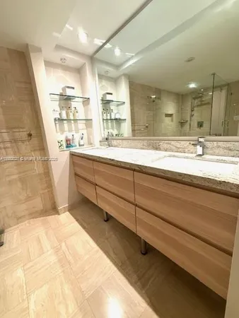 a bedroom with bed and window