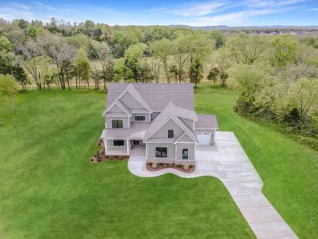 a view of a park with large trees