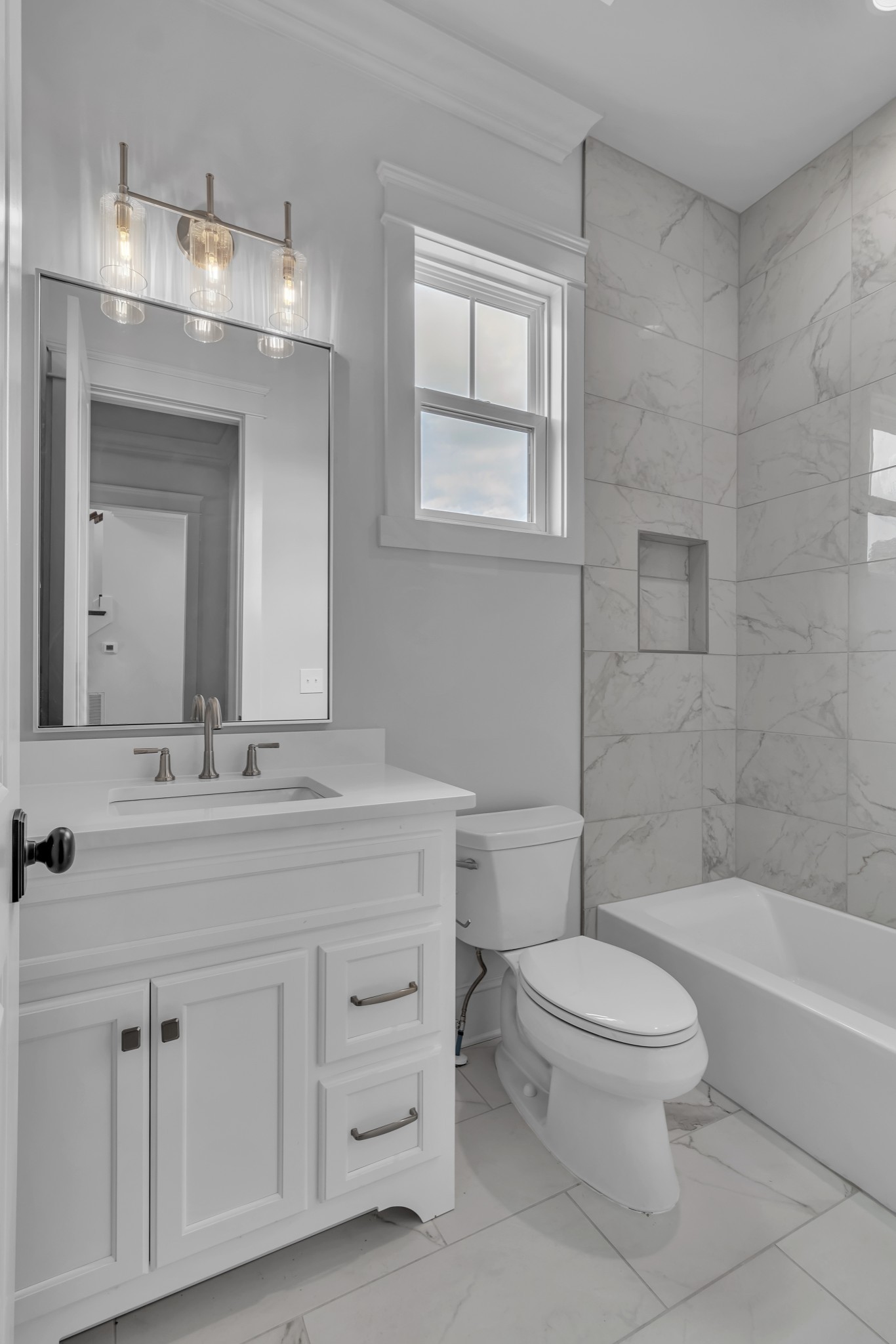 7004 Twelve Corners Road Lascassas, TN 37085 - Photo 35 of 67 a bathroom with a toilet a sink a mirror a bathtub and vanity