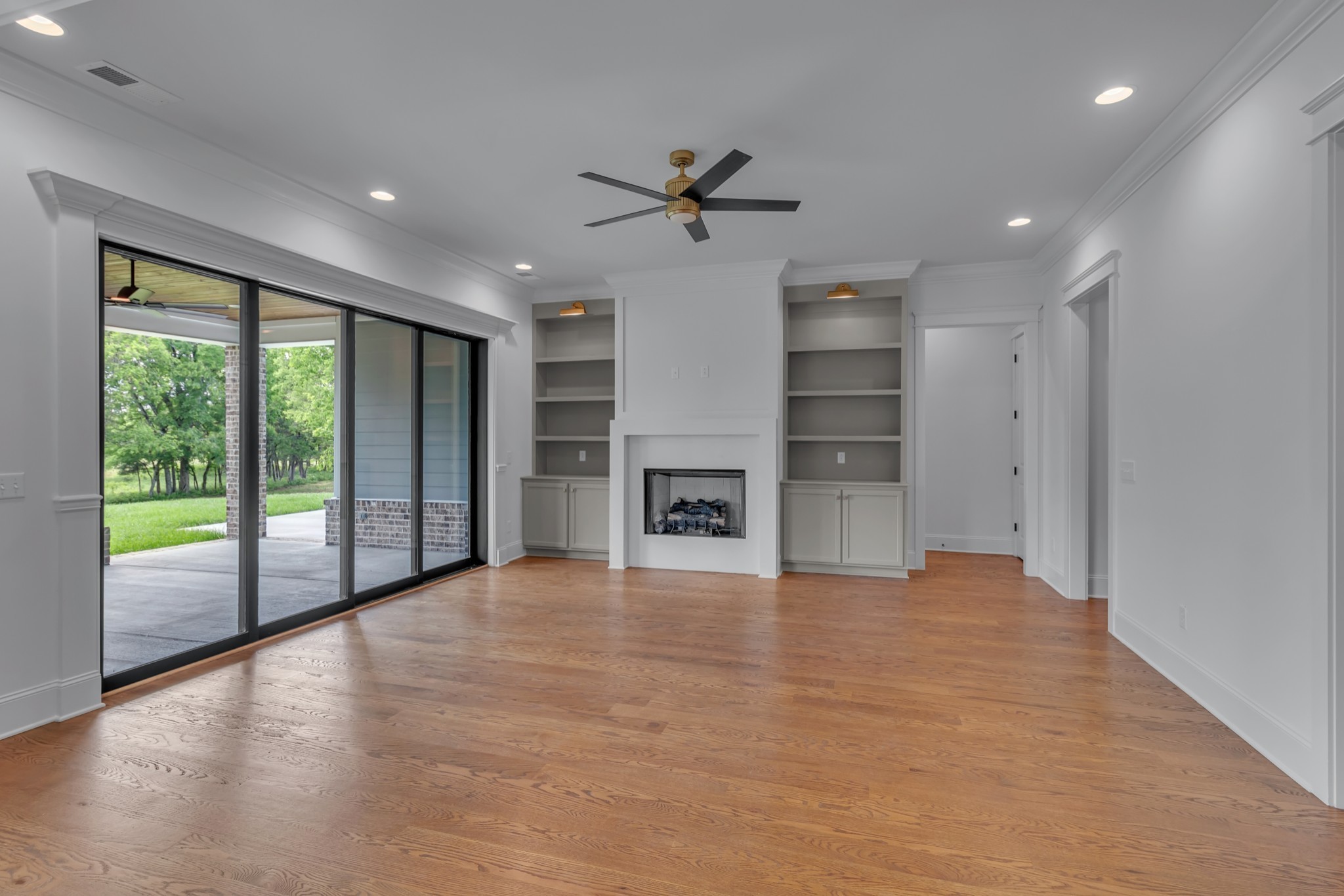7004 Twelve Corners Road Lascassas, TN 37085 - Photo 37 of 67 a view of an empty room with a fireplace and a window