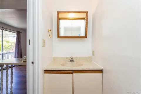 a bathroom with a toilet sink and vanity
