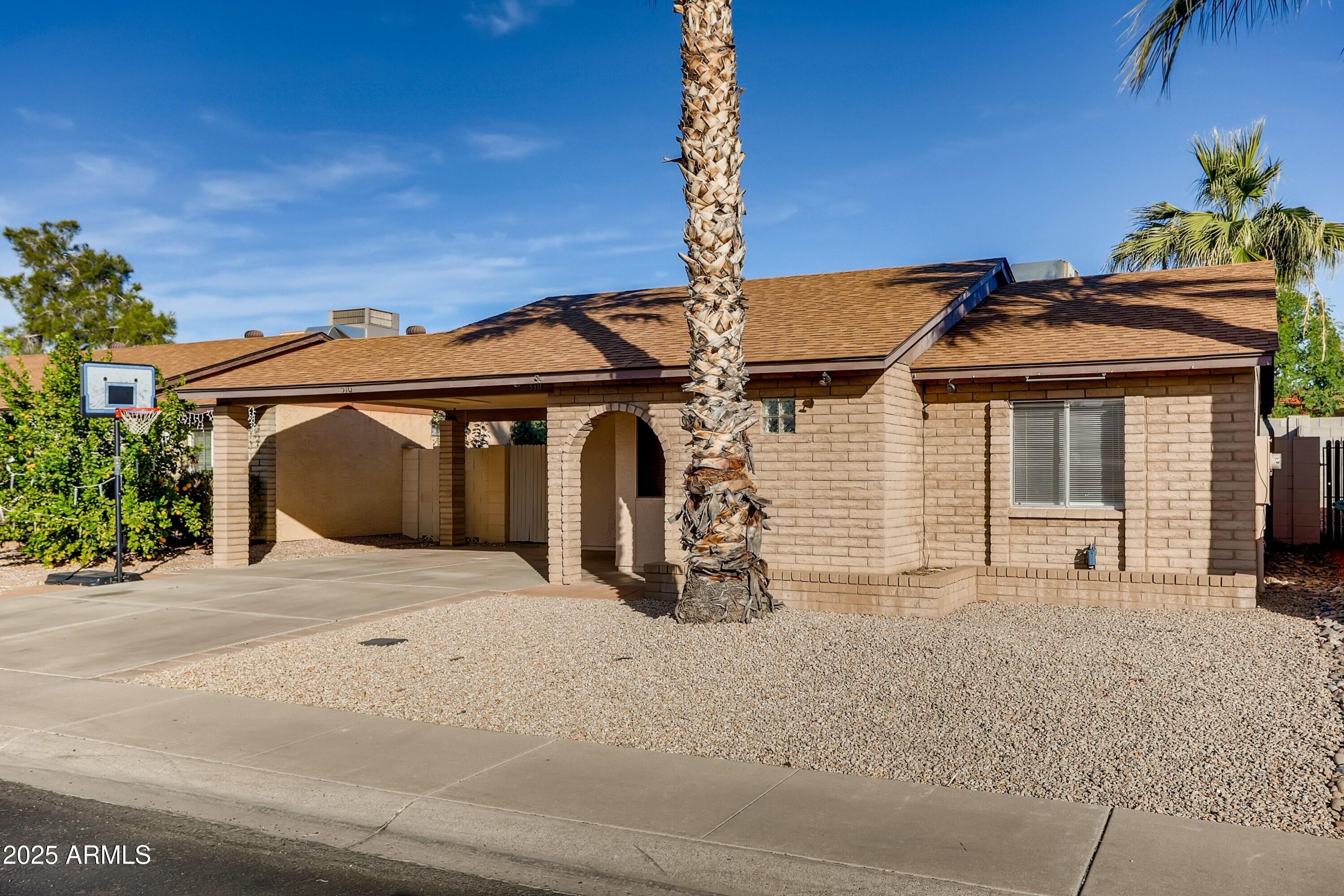 510 East Sequoia Drive Phoenix, AZ 85024 - Photo 2 of 12 a front view of a house with garden