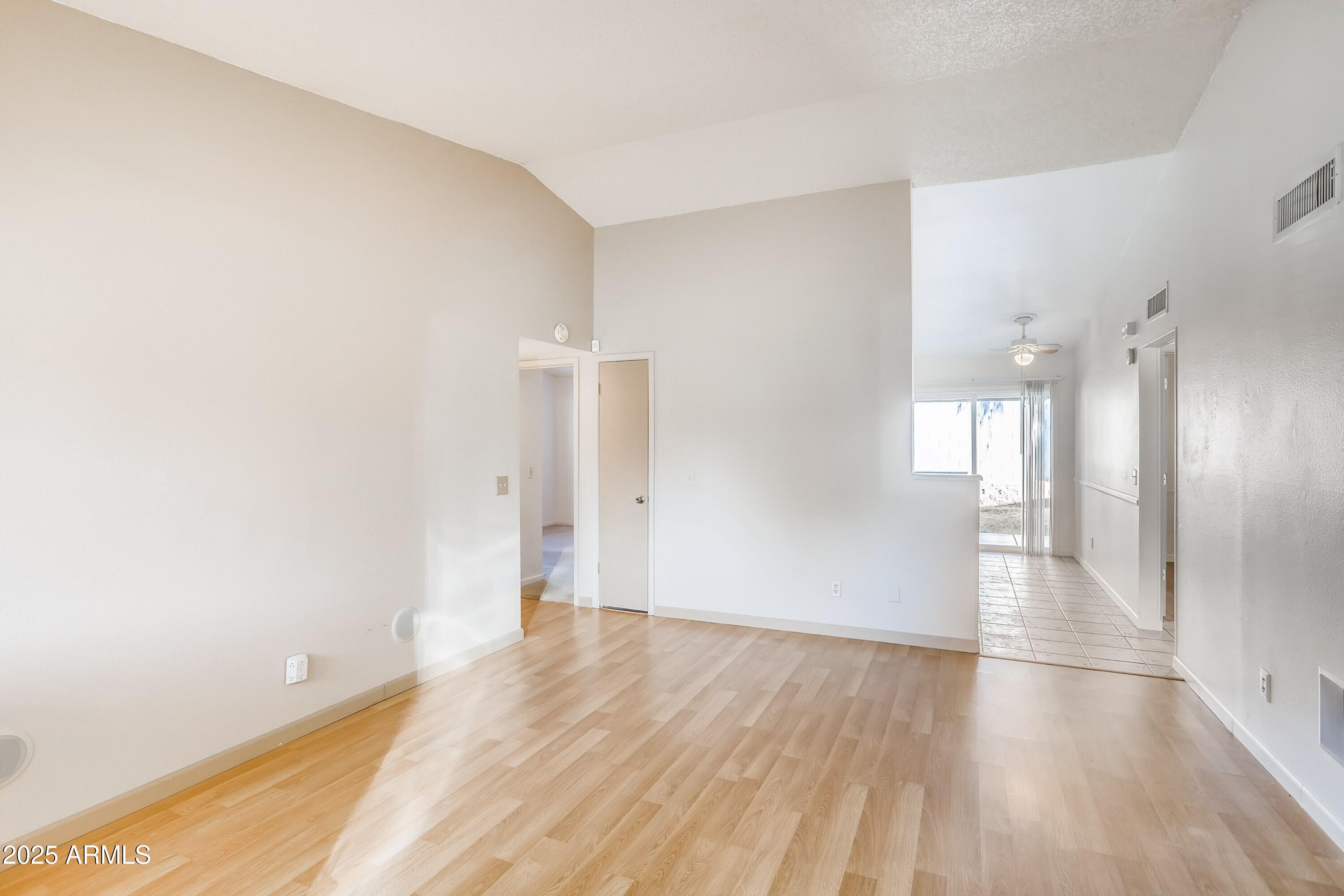 510 East Sequoia Drive Phoenix, AZ 85024 - Photo 5 of 12 a view of empty room with wooden floor