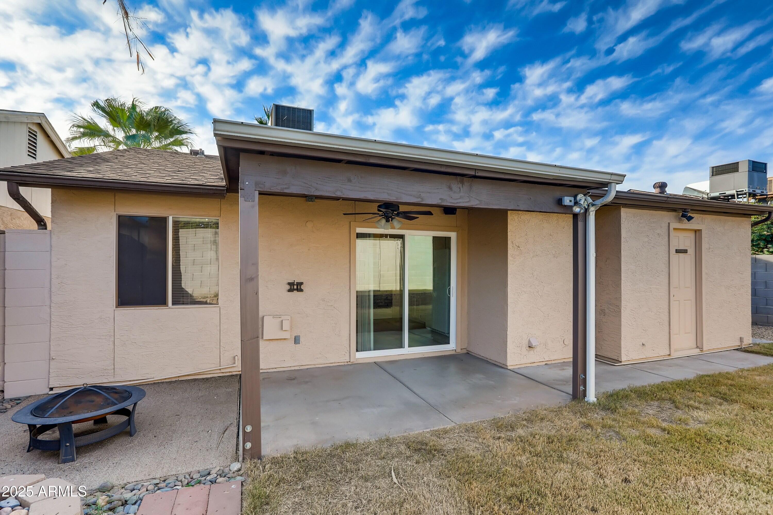 510 East Sequoia Drive Phoenix, AZ 85024 - Photo 10 of 12 a backyard of a house with garage