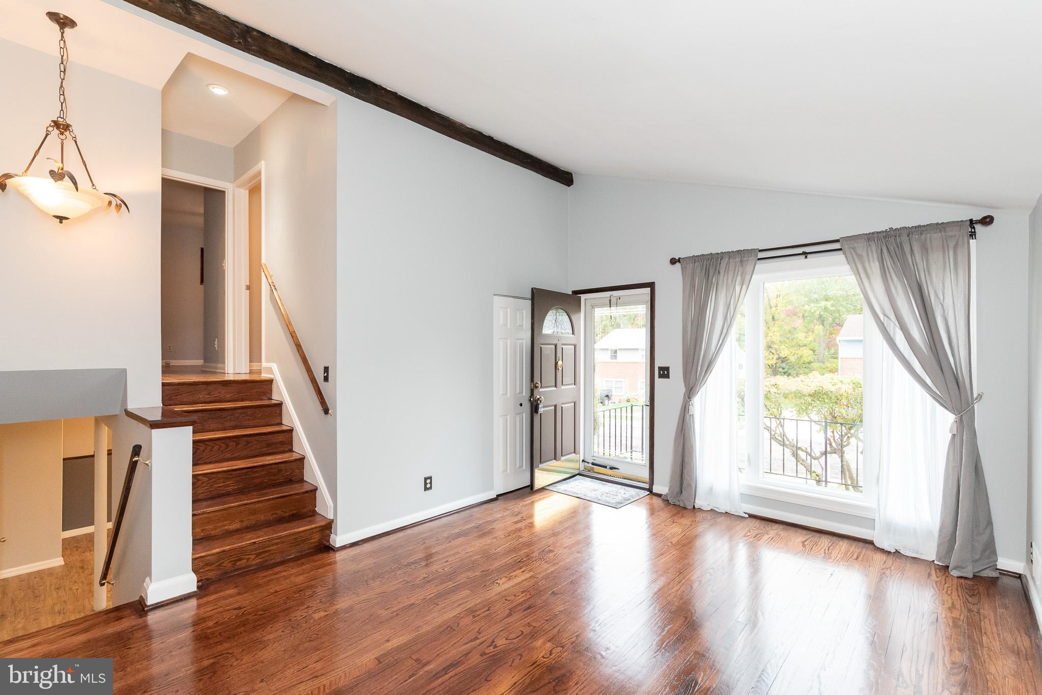 9109 Orbitan Road Baltimore, MD 21234 - Photo 4 of 47 Stairs to LL and UL from Living Room