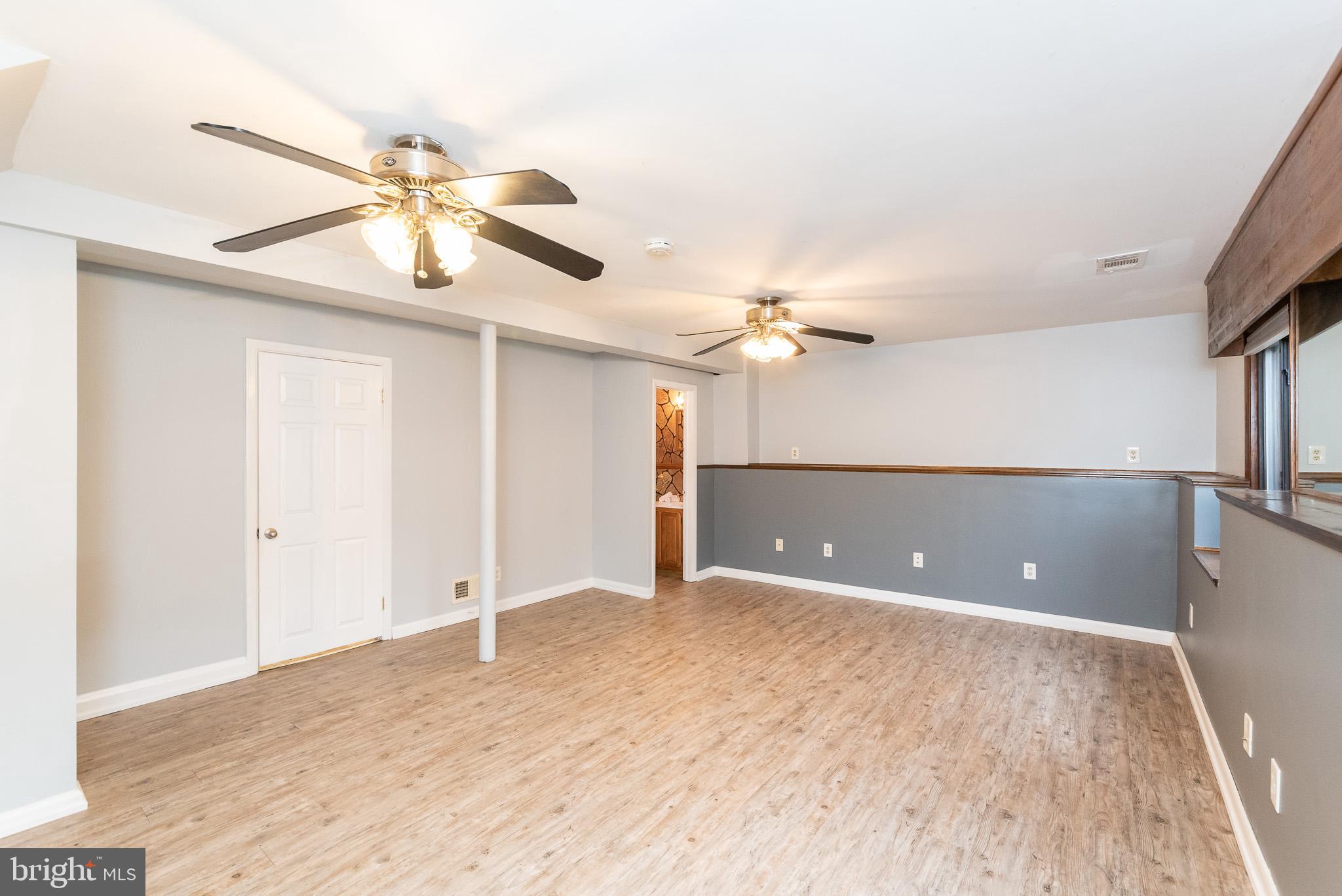 9109 Orbitan Road Baltimore, MD 21234 - Photo 35 of 47 LL Family Room with Vinyl Plank Flooring