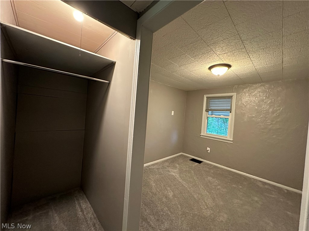 1086 Bruce Road Akron, OH 44306 - Photo 22 of 45 front bedroom/closet. New flooring. pic 1 of 4