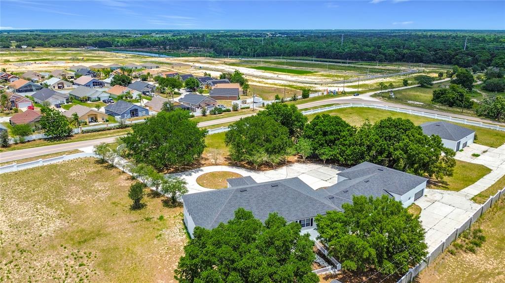 7925 Lake Mabel Loop Road Lake Wales, FL 33898 - Photo 10 of 97 an aerial view of a house with garden space and outdoor space