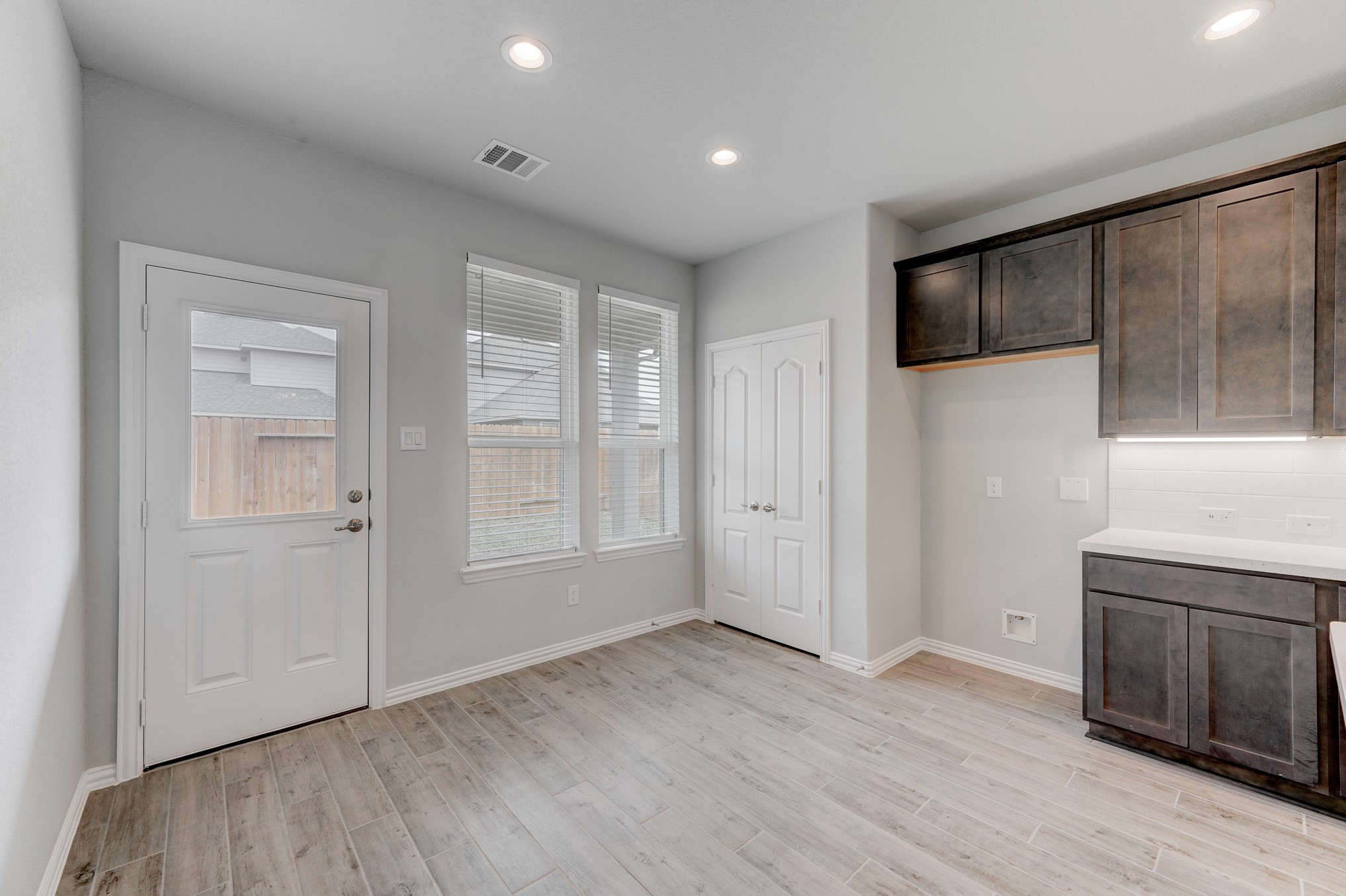 1229 Red Hills Drive Rosharon, TX 77583 - Photo 11 of 29 an empty room with wooden floor and windows