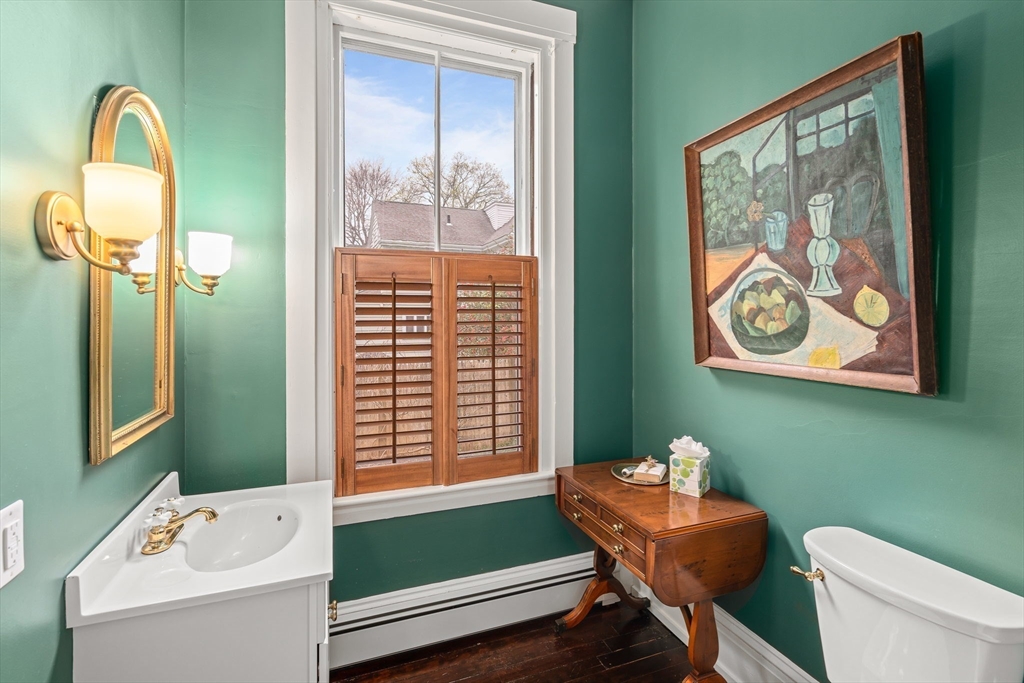 135 Court Street Dedham, MA 02026 - Photo 18 of 40 a bathroom with a toilet sink and tub