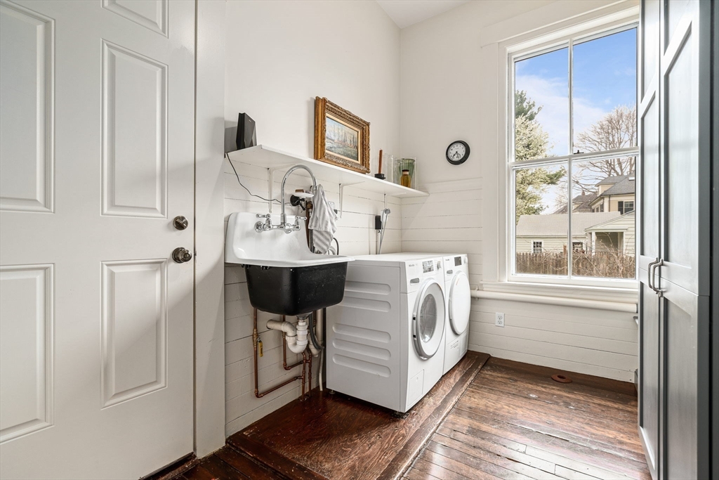 135 Court Street Dedham, MA 02026 - Photo 19 of 40 a utility room with a window dryer and washer