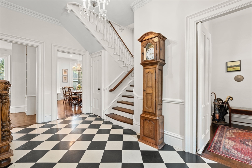 135 Court Street Dedham, MA 02026 - Photo 3 of 40 a view of a entryway door with a rug