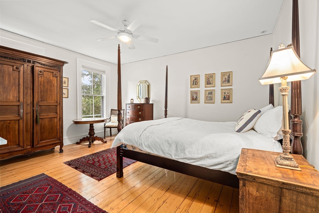 135 Court Street Dedham, MA 02026 - Photo 31 of 40 a bedroom with a bed window and table chair