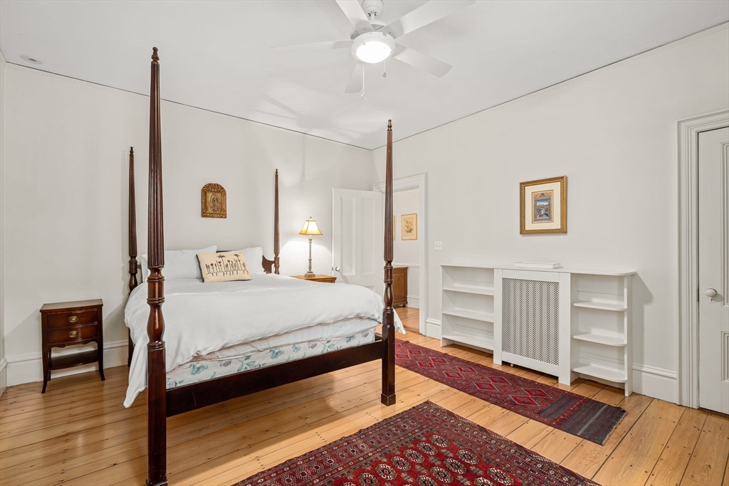 135 Court Street Dedham, MA 02026 - Photo 32 of 40 a bedroom with a bed and a table