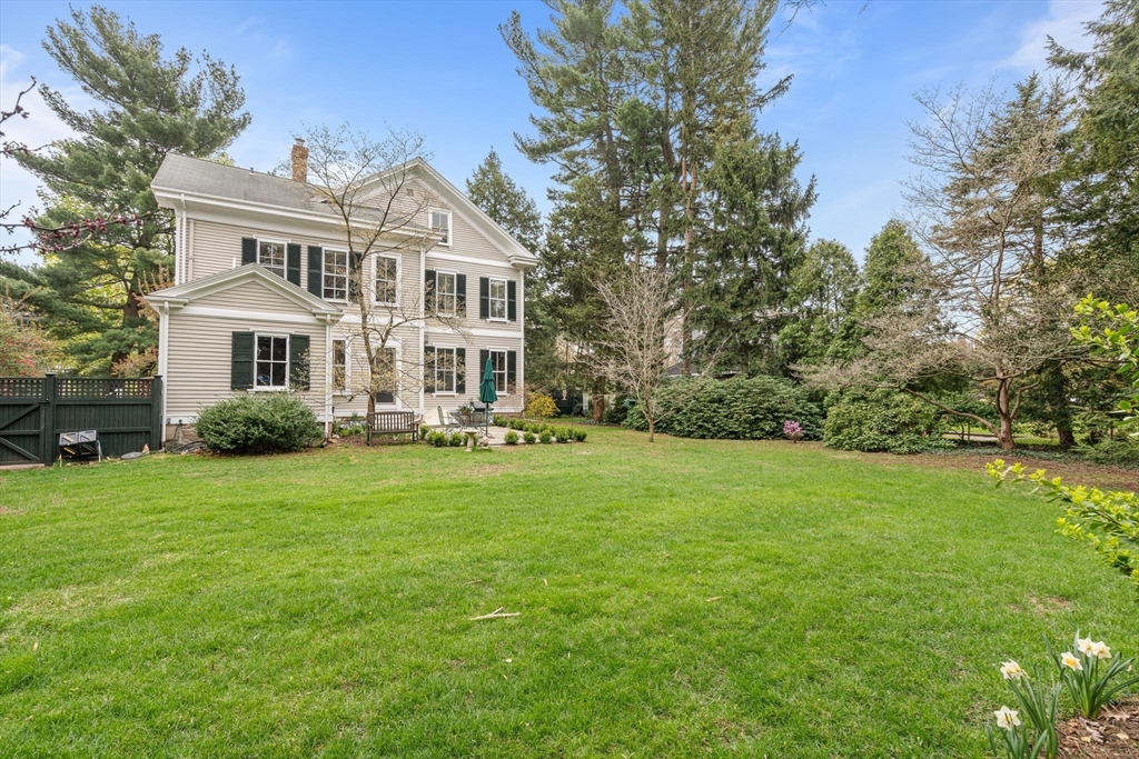 135 Court Street Dedham, MA 02026 - Photo 33 of 40 a front view of a house with a yard