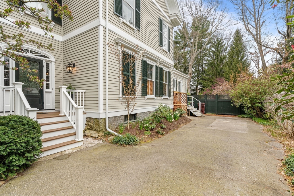 135 Court Street Dedham, MA 02026 - Photo 37 of 40 front view of a house with a yard