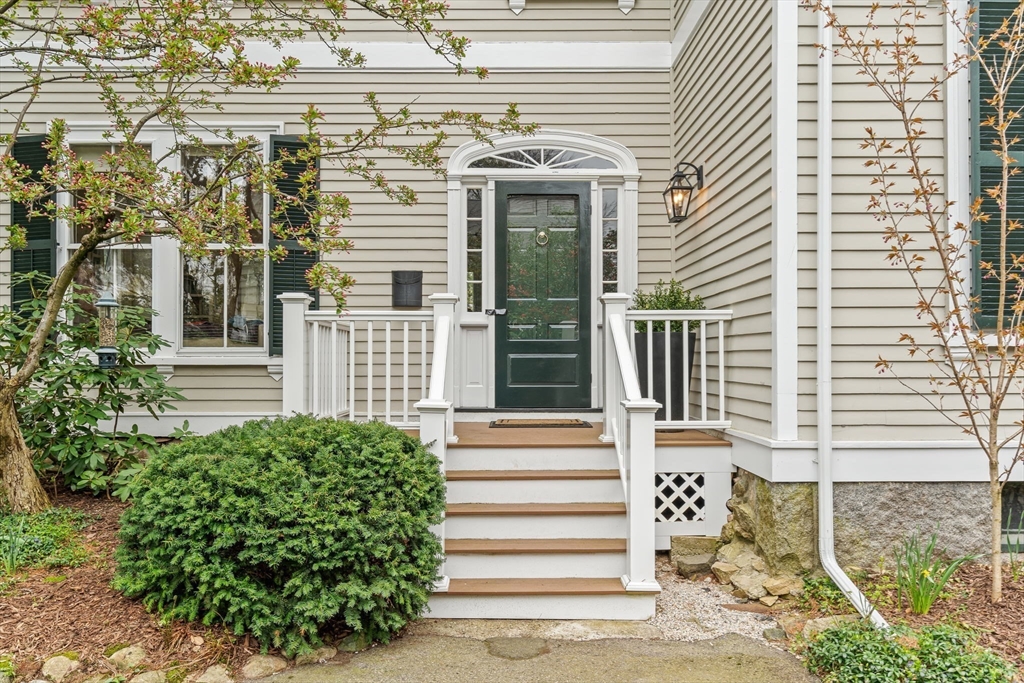135 Court Street Dedham, MA 02026 - Photo 38 of 40 a front view of a house with a garden