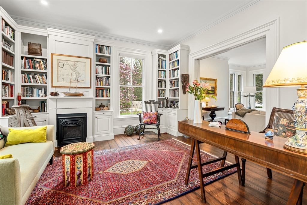 135 Court Street Dedham, MA 02026 - Photo 5 of 40 a living room with furniture a fireplace and next to a window