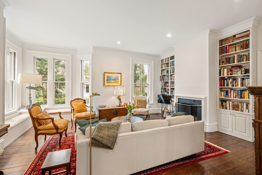 135 Court Street Dedham, MA 02026 - Photo 8 of 40 a living room with fireplace furniture and a large window