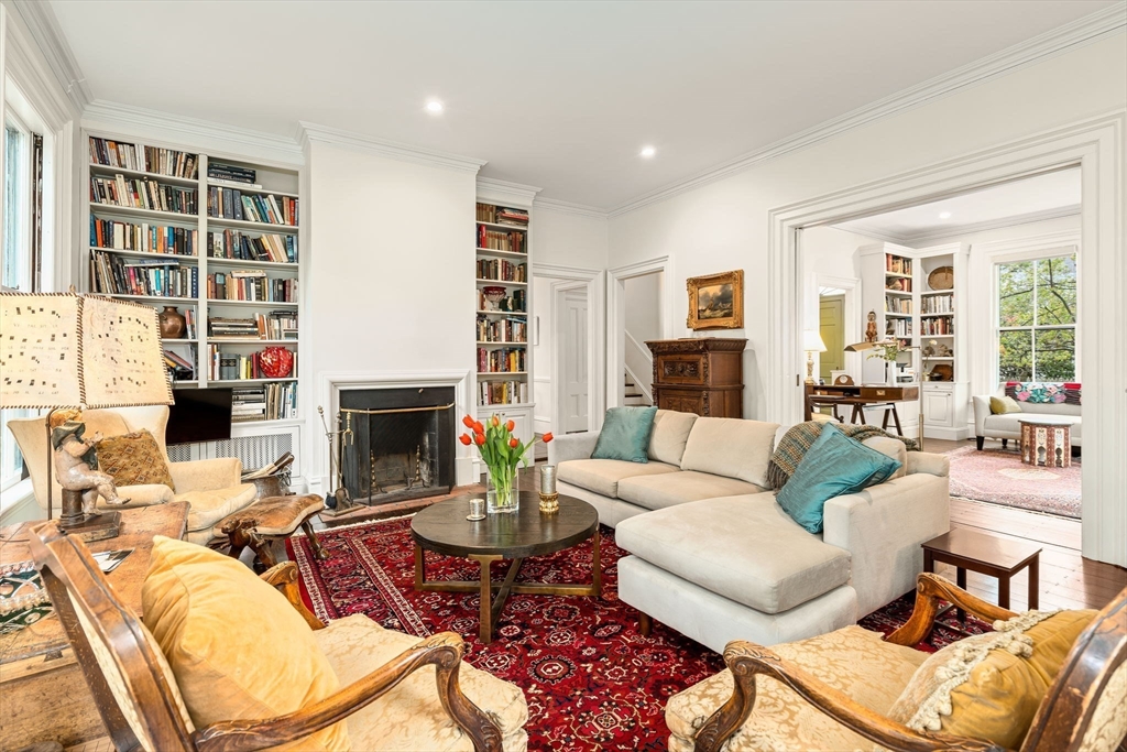 135 Court Street Dedham, MA 02026 - Photo 10 of 40 a living room with furniture a fireplace and a large window