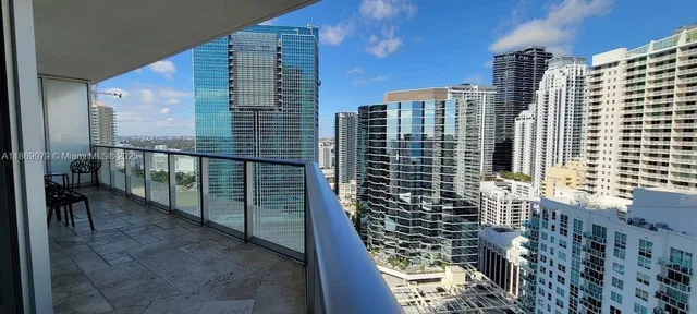 a view of balcony with a couple of buildings