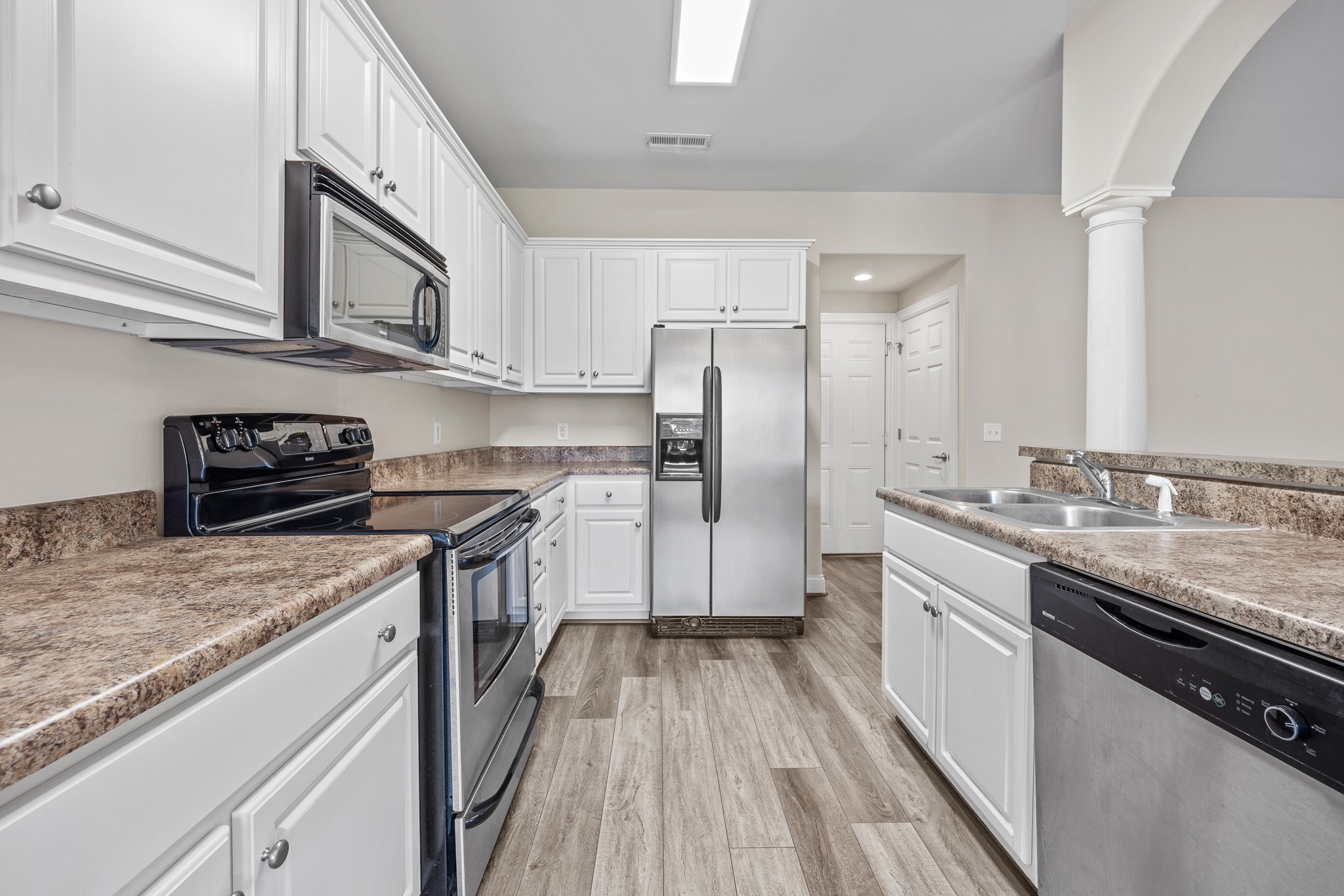 2521 Pennington Bend Road, Unit 119 Nashville, TN 37214 - Photo 13 of 47 a kitchen with stainless steel appliances granite countertop a sink stove and refrigerator