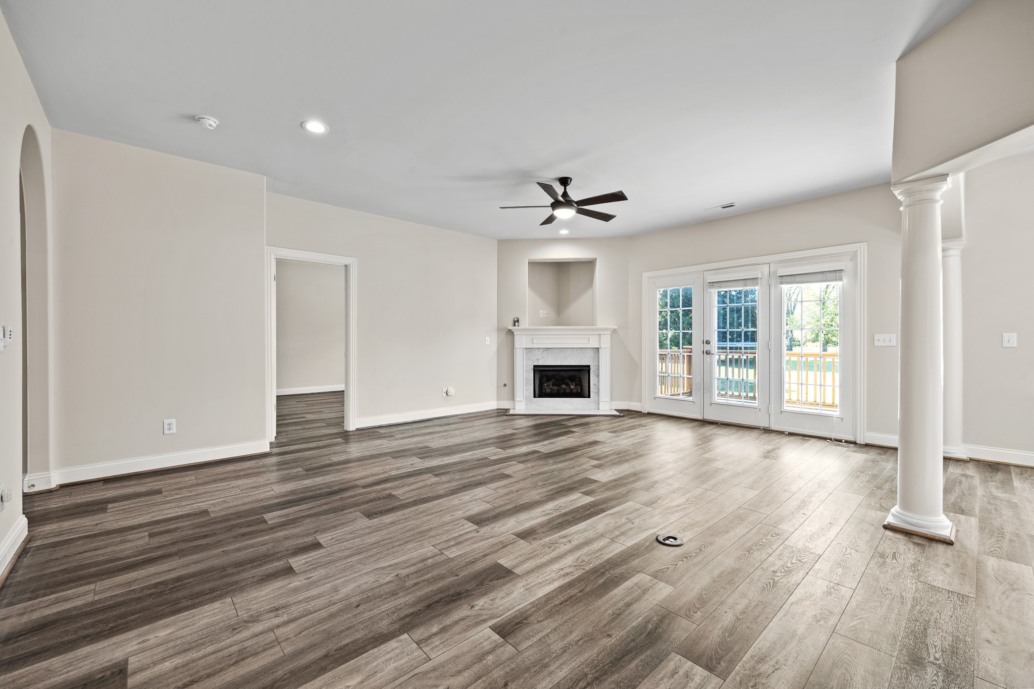 2521 Pennington Bend Road, Unit 119 Nashville, TN 37214 - Photo 15 of 47 a view of empty room with wooden floor and fireplace