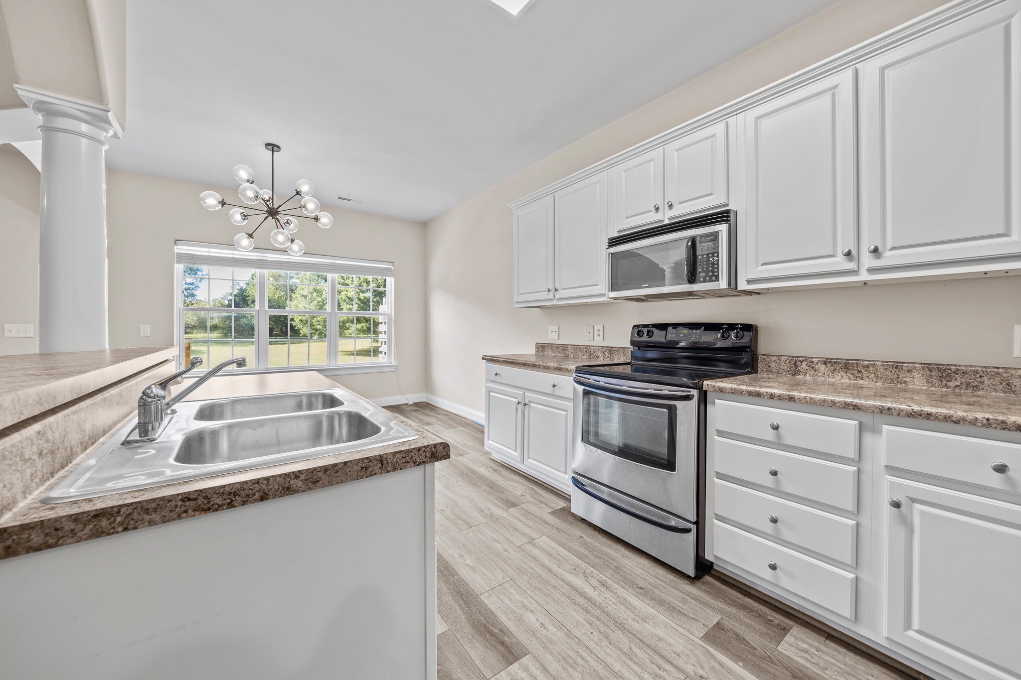 2521 Pennington Bend Road, Unit 119 Nashville, TN 37214 - Photo 16 of 47 a kitchen that has a sink and a stove