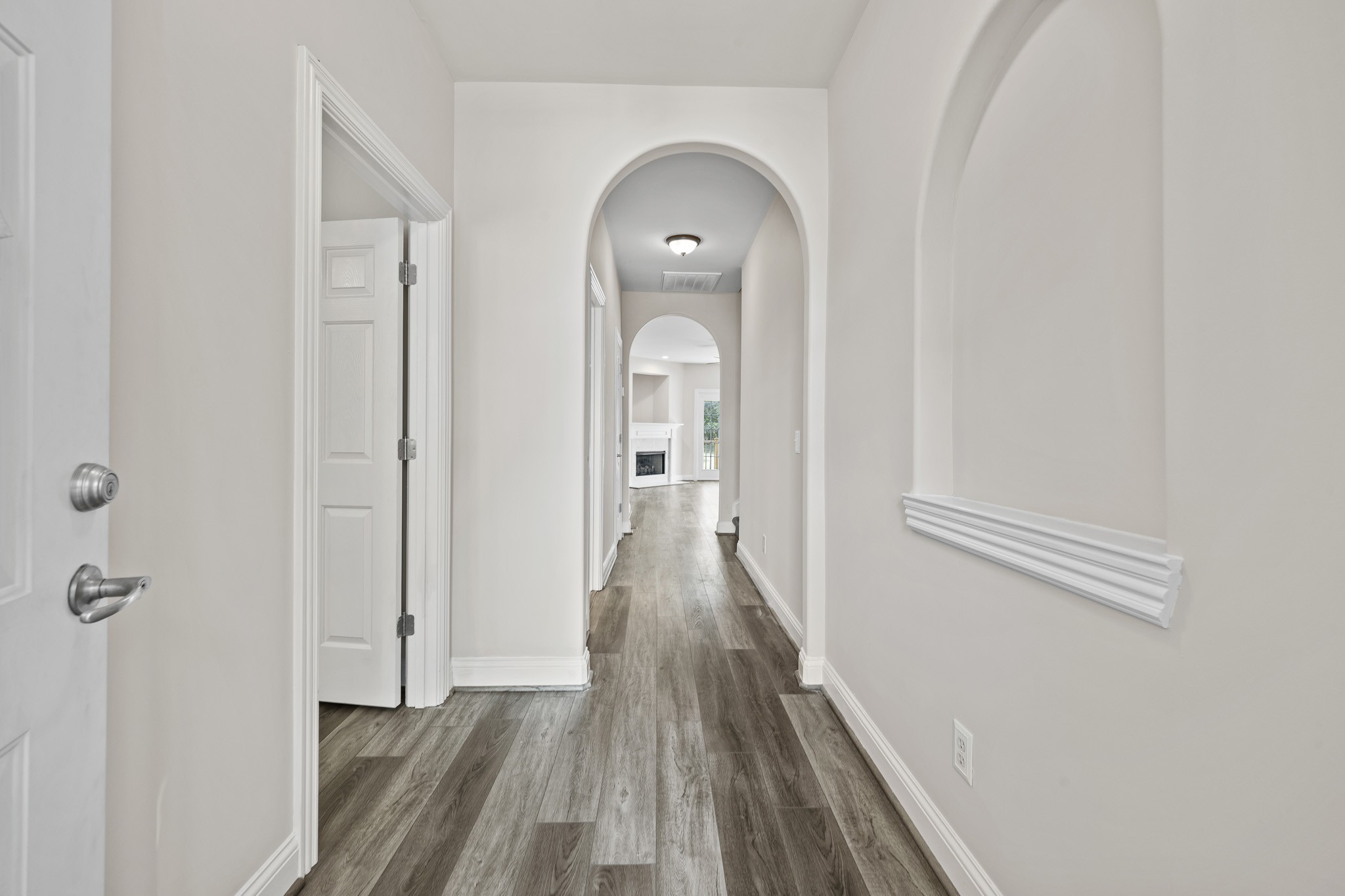 2521 Pennington Bend Road, Unit 119 Nashville, TN 37214 - Photo 3 of 47 a view of a hallway with wooden floor and a bathroom