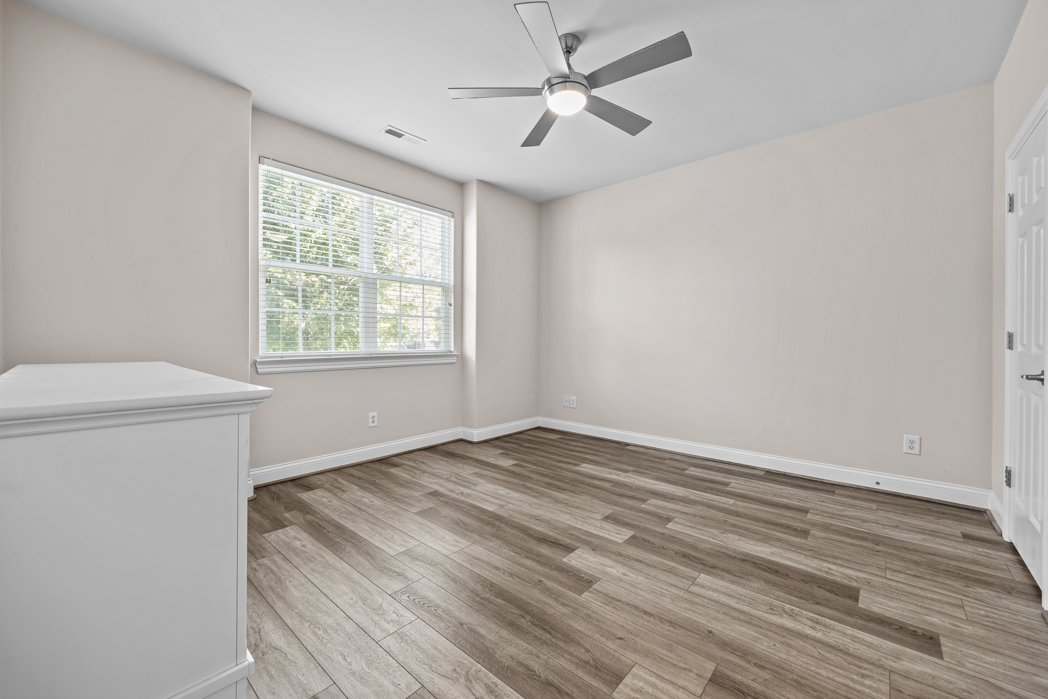 2521 Pennington Bend Road, Unit 119 Nashville, TN 37214 - Photo 5 of 47 wooden floor in an empty room with a window
