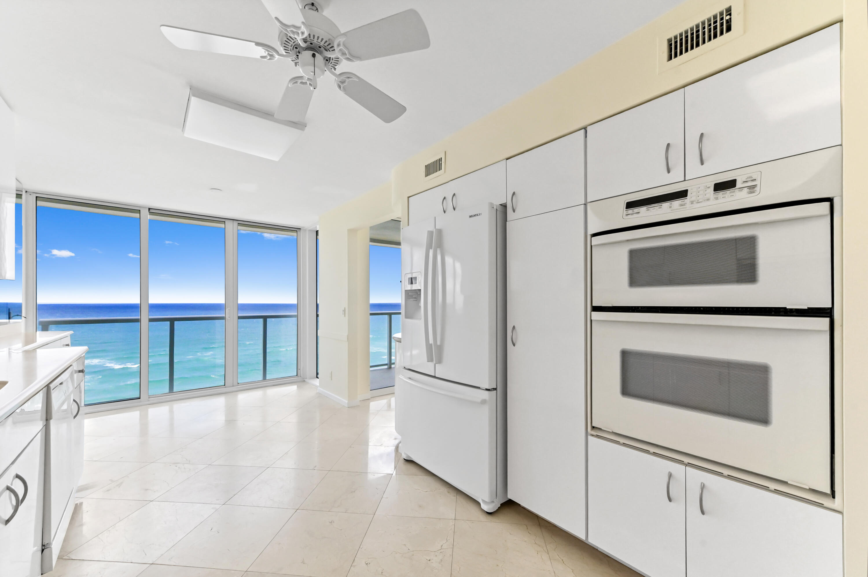 2800 South Ocean Boulevard, Unit 11M Boca Raton, FL 33432 - Photo 11 of 65 a kitchen with stainless steel appliances a refrigerator cabinets and a stove top oven