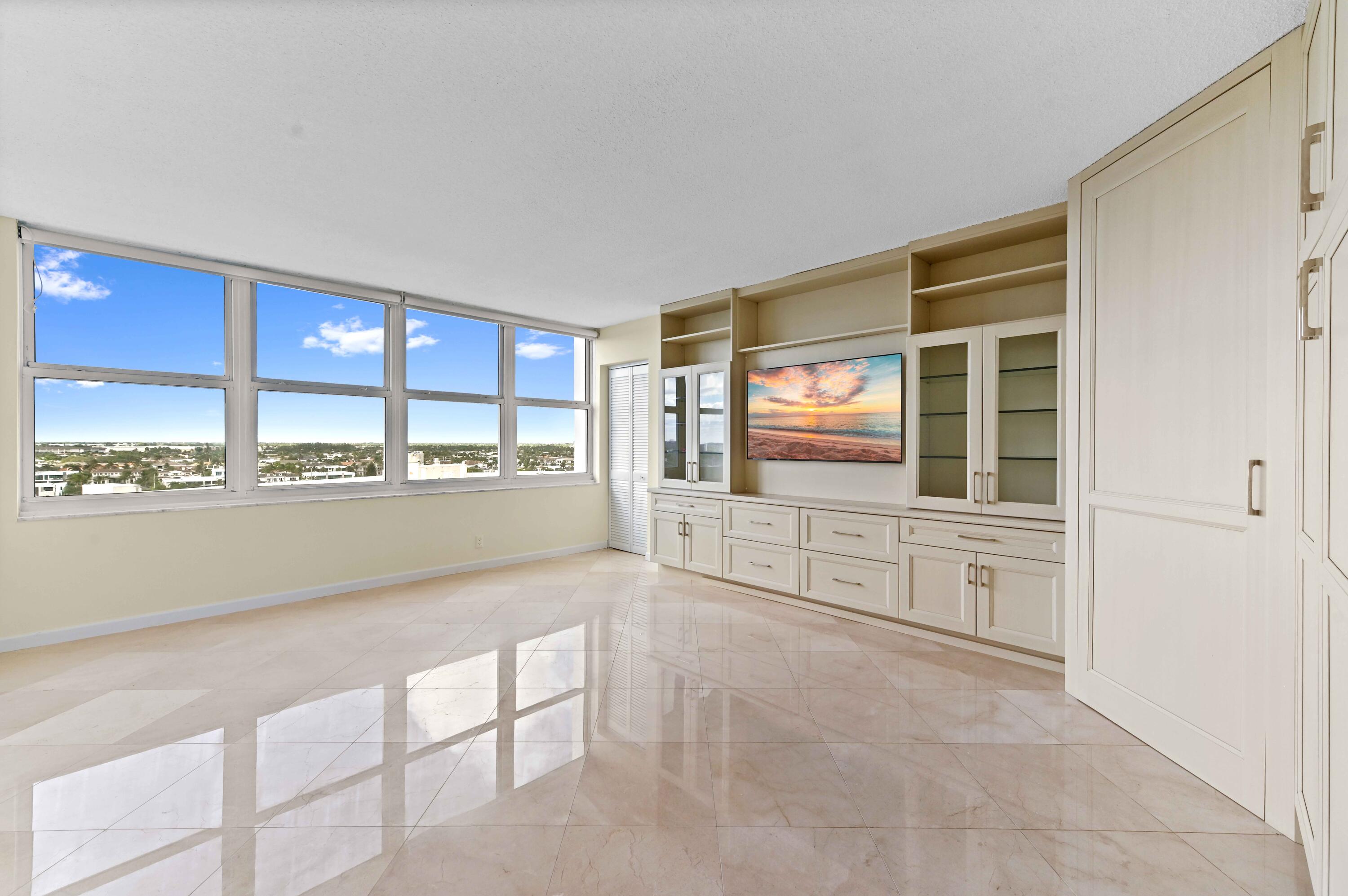 2800 South Ocean Boulevard, Unit 11M Boca Raton, FL 33432 - Photo 18 of 65 a view of open kitchen with granite countertop cabinets and a sink