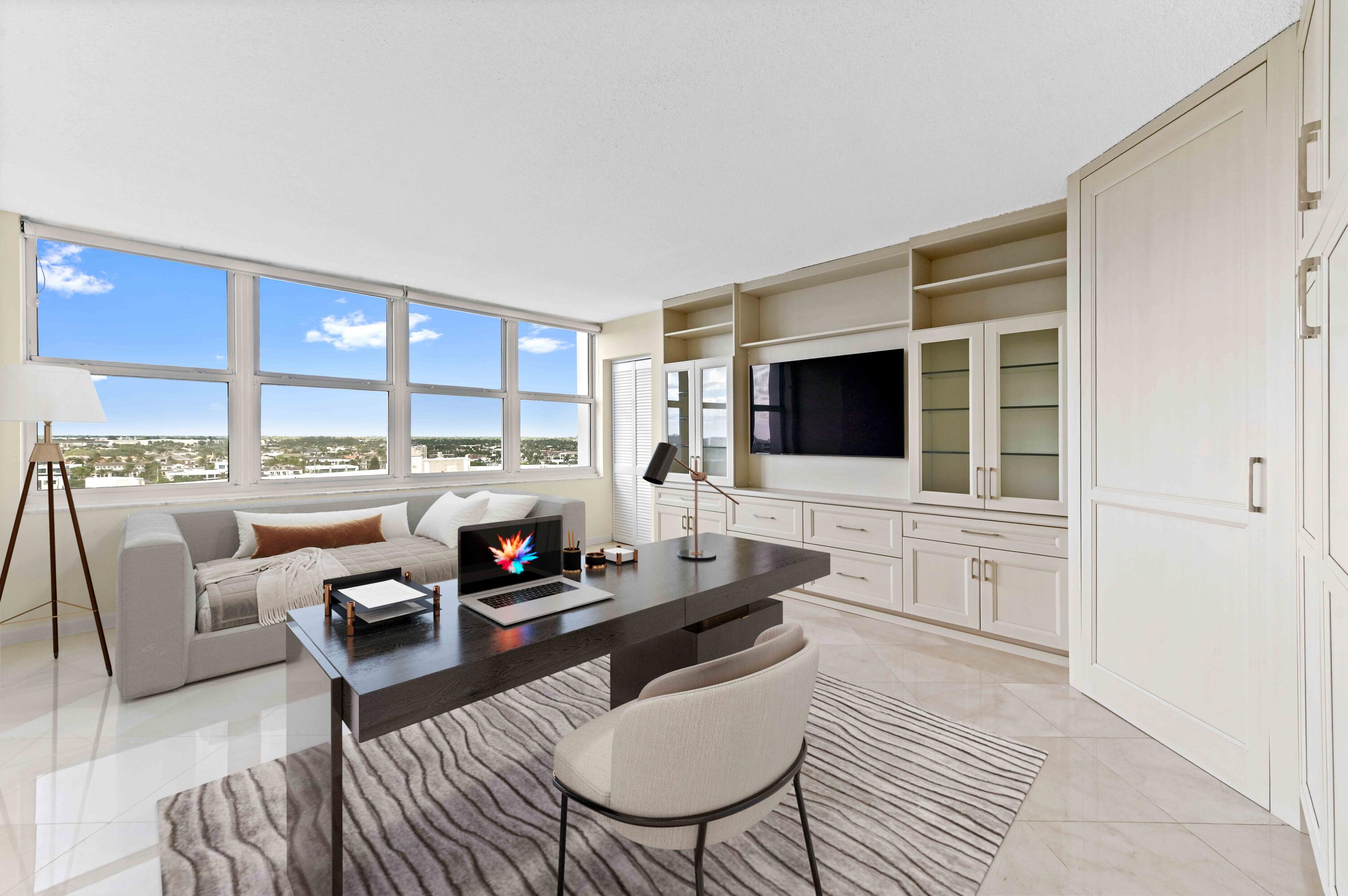 2800 South Ocean Boulevard, Unit 11M Boca Raton, FL 33432 - Photo 19 of 65 a living room with furniture and a flat screen tv