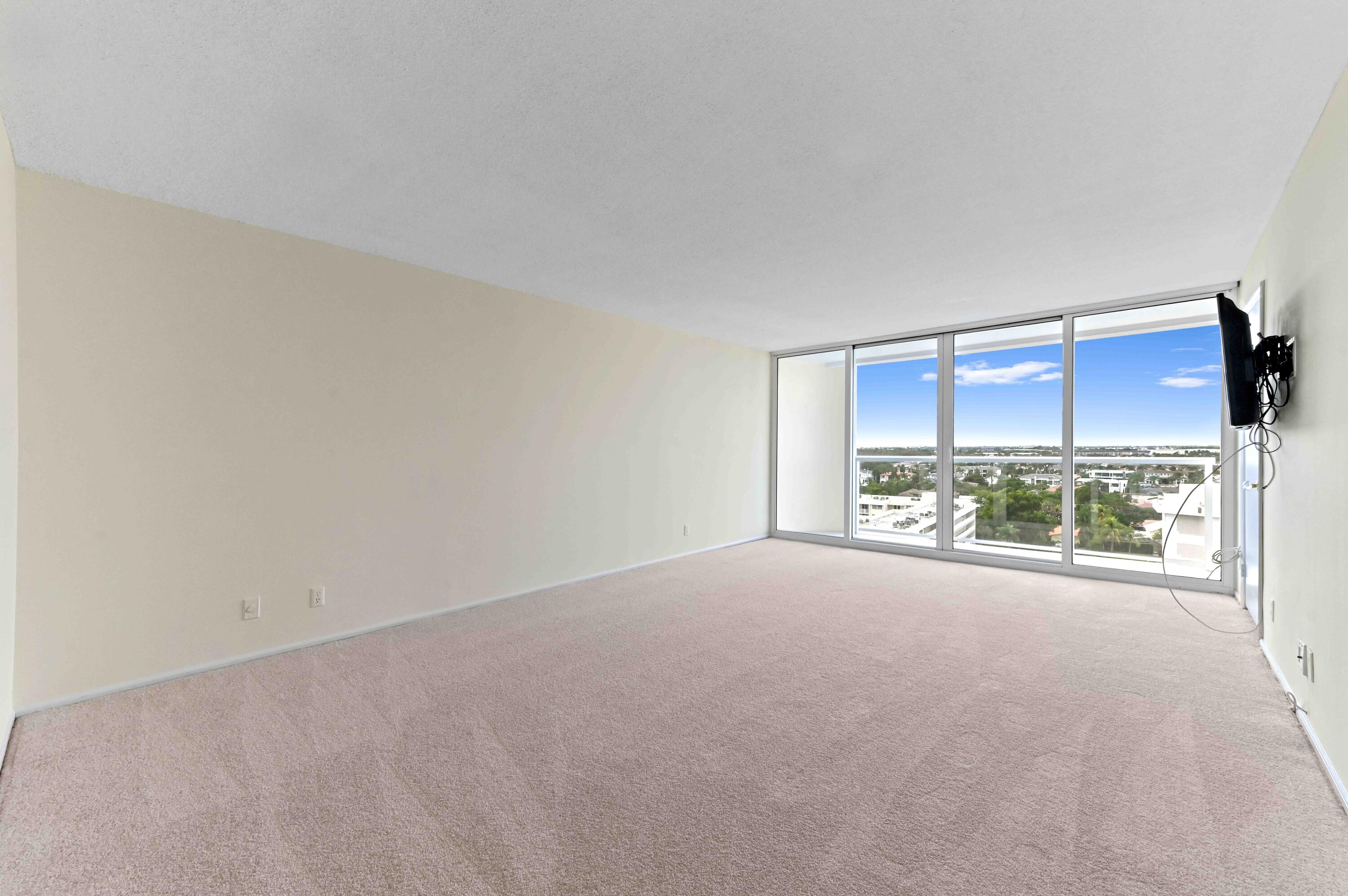 2800 South Ocean Boulevard, Unit 11M Boca Raton, FL 33432 - Photo 26 of 65 an empty room with a fireplace