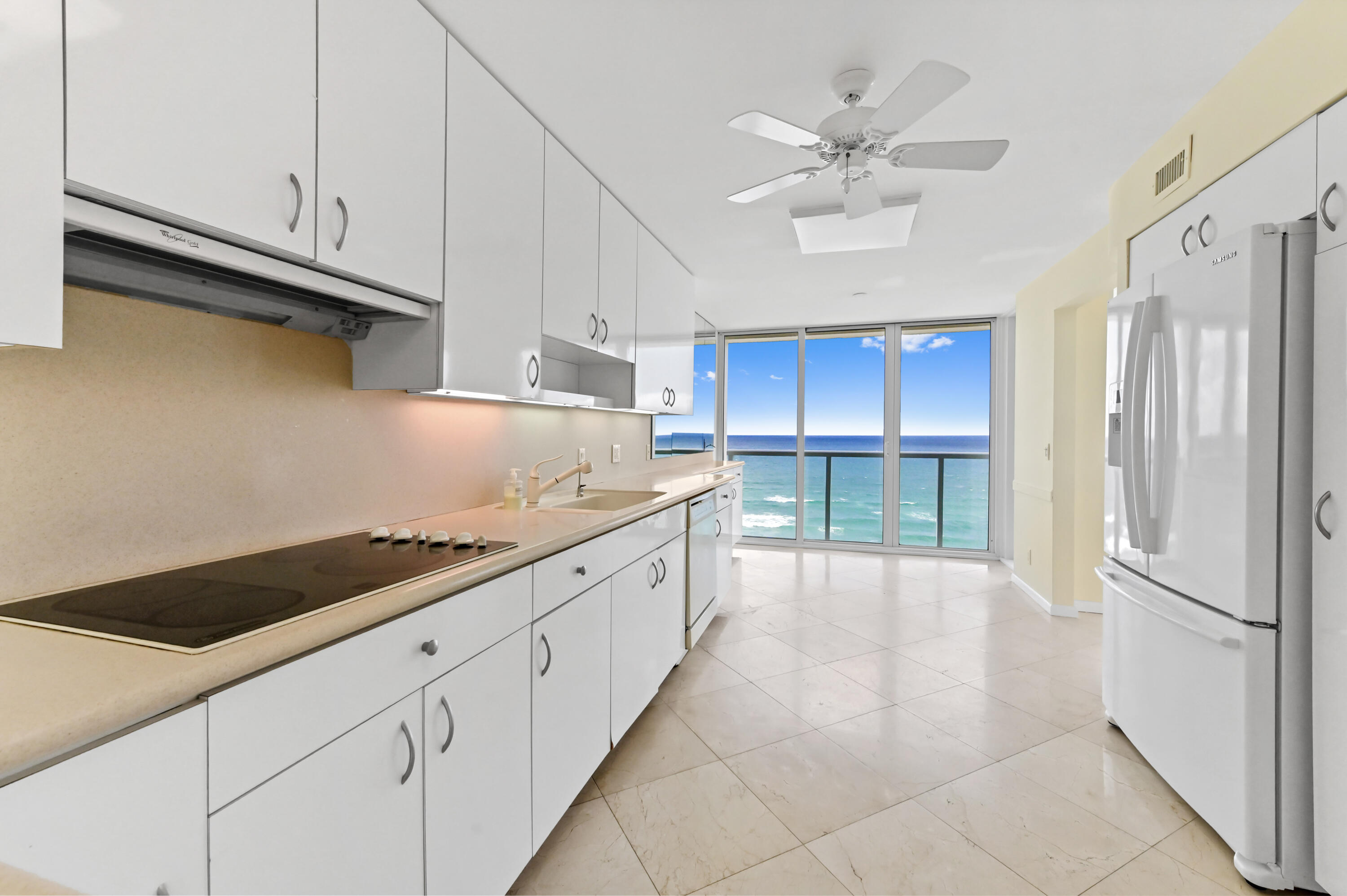 2800 South Ocean Boulevard, Unit 11M Boca Raton, FL 33432 - Photo 8 of 65 a large kitchen with cabinets and a stainless steel appliances