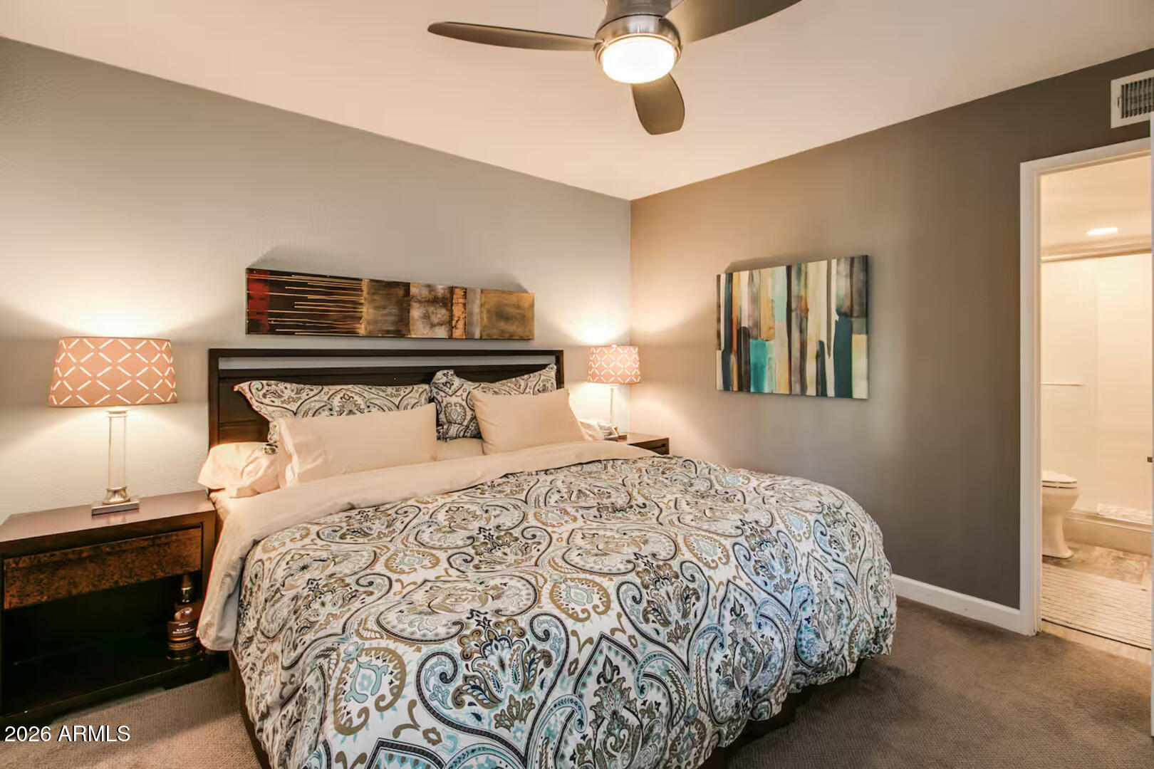 7625 East Camelback Road, Unit B133 Scottsdale, AZ 85251 - Photo 5 of 30 a bedroom with a bed and wooden floor