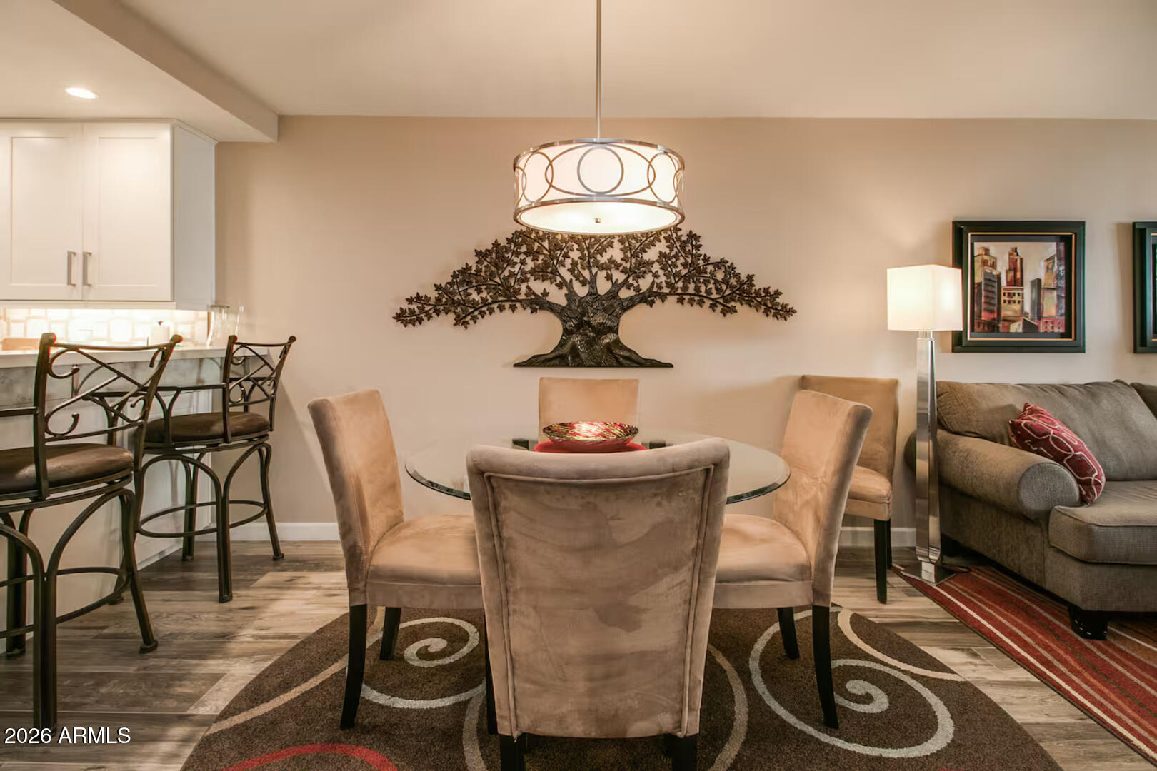 7625 East Camelback Road, Unit B133 Scottsdale, AZ 85251 - Photo 9 of 30 a view of a dining room with furniture and wooden floor