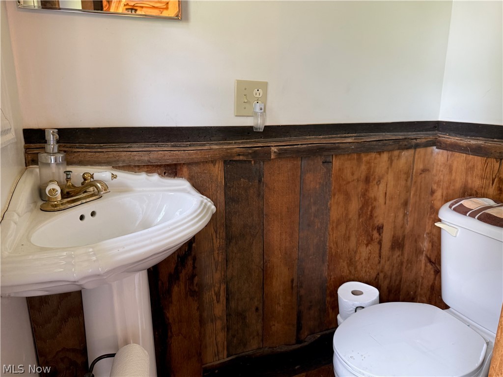 11811 Gaston Road Rogers, OH 44455 - Photo 29 of 38 Enjoy your time inside this cozy, functional, and equipped log cabin! You've already got the important utilities like electric, geo-thermal heat, a septic system installed 6 years ago, and private well water.