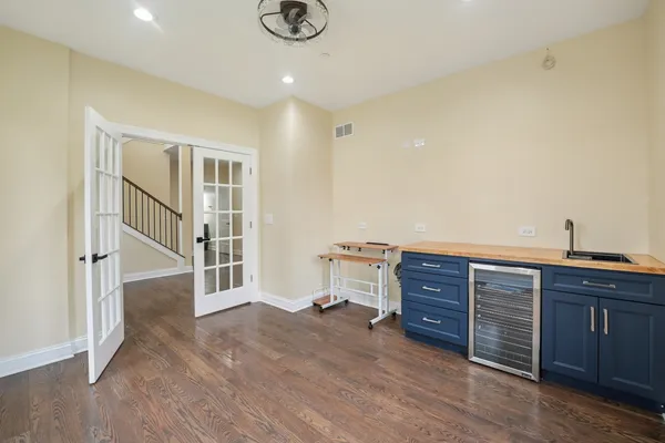 a view of a livingroom with wooden furniture