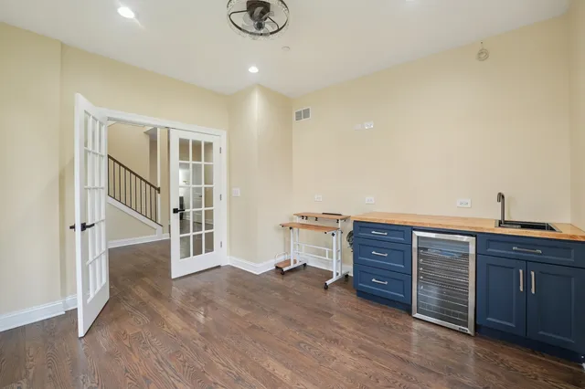 a view of a livingroom with wooden furniture