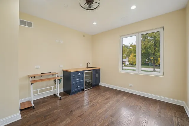 a view of workspace with furniture and window
