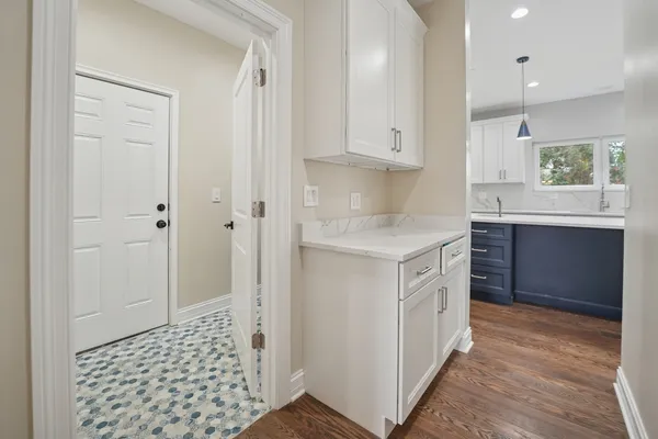 a kitchen with a sink cabinets and window