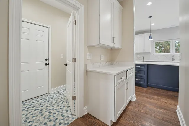 a kitchen with a sink cabinets and window