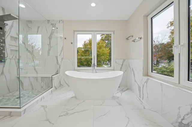 a bathroom with a bathtub and shower