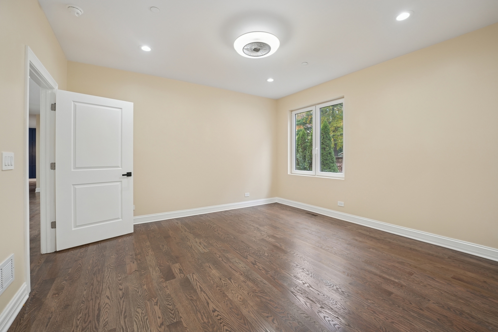 1133 Fortuna Avenue Park Ridge, IL 60068 - Photo 29 of 41 a view of an empty room with wooden floor and a window