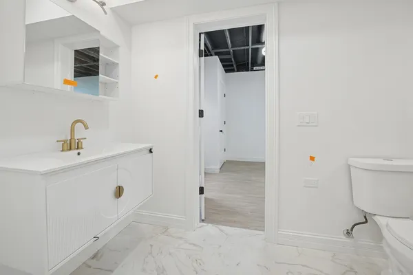 a bathroom with a sink and a toilet